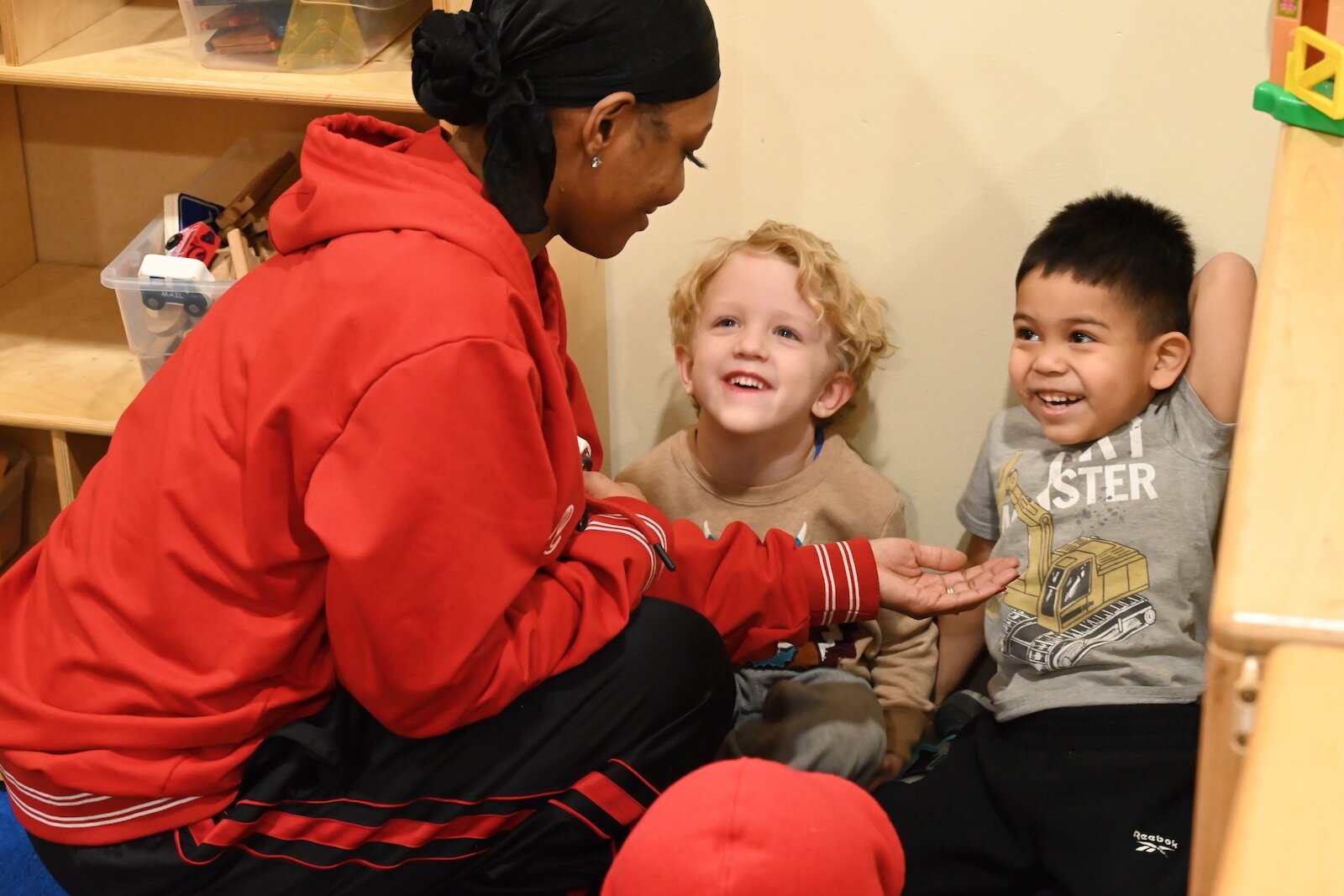 Susan Hightower, lead teacher for Great Start Readiness Program, is seen with Axel Jordan, center, and Brayan Chinchila at LaEscuelita International Bilingual Early Childhood Education Center.