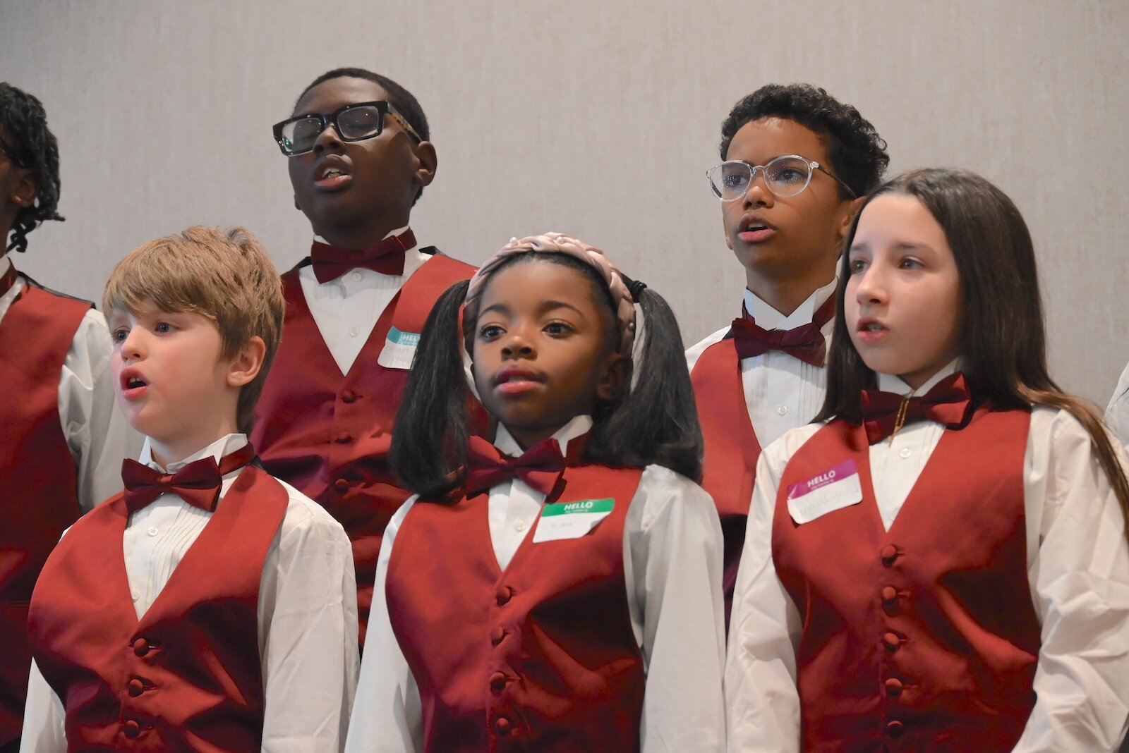 Members of the Sojourner Truth Choir sing during a performance at the National Day of Racial Healing event, from left, front row, Trent, MeAhla, and EmmaLynn, and back row Helani and Jayonna.