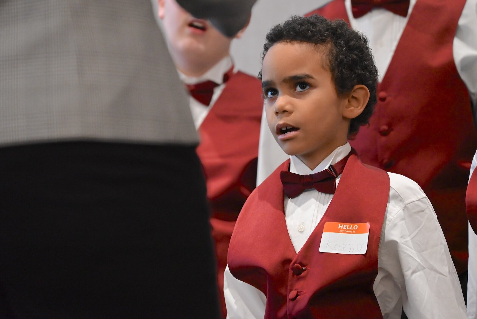 Korben, a member of the Sojourner Truth Choir, watches choir director Jenelle McKenzie, during a performance at the National Day of Racial Healing event