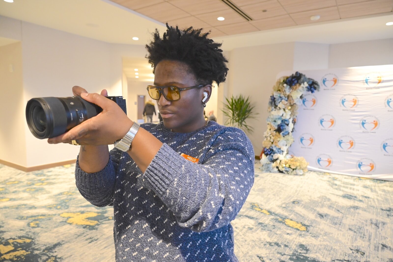 Vania Ward of the Art and Culture Collective of Battle Creek takes photos during Battle Creek Truth, Racial Healing, and Transformation’s (BCTRHT) National Day of Racial Healing event.