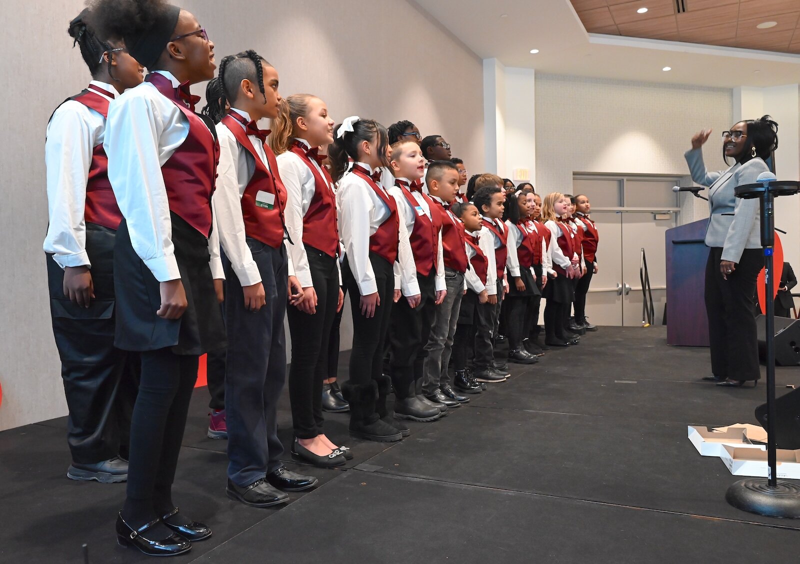 Jenelle McKenzie directs the Sojourner Truth Choir during the National Day of Racial Healing event.