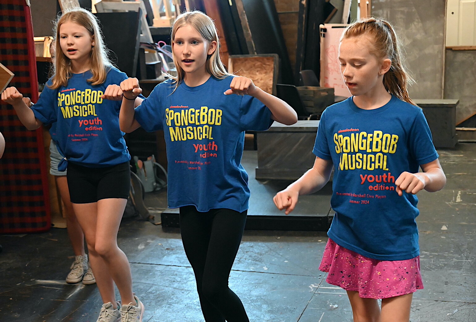 Rehearsing a dance scene for the Marshall Civic Players production of “The SpongeBob Musical-Youth Edition” are, from left, Claire Swender, Dede Weaver, and Madeleine Weeks.