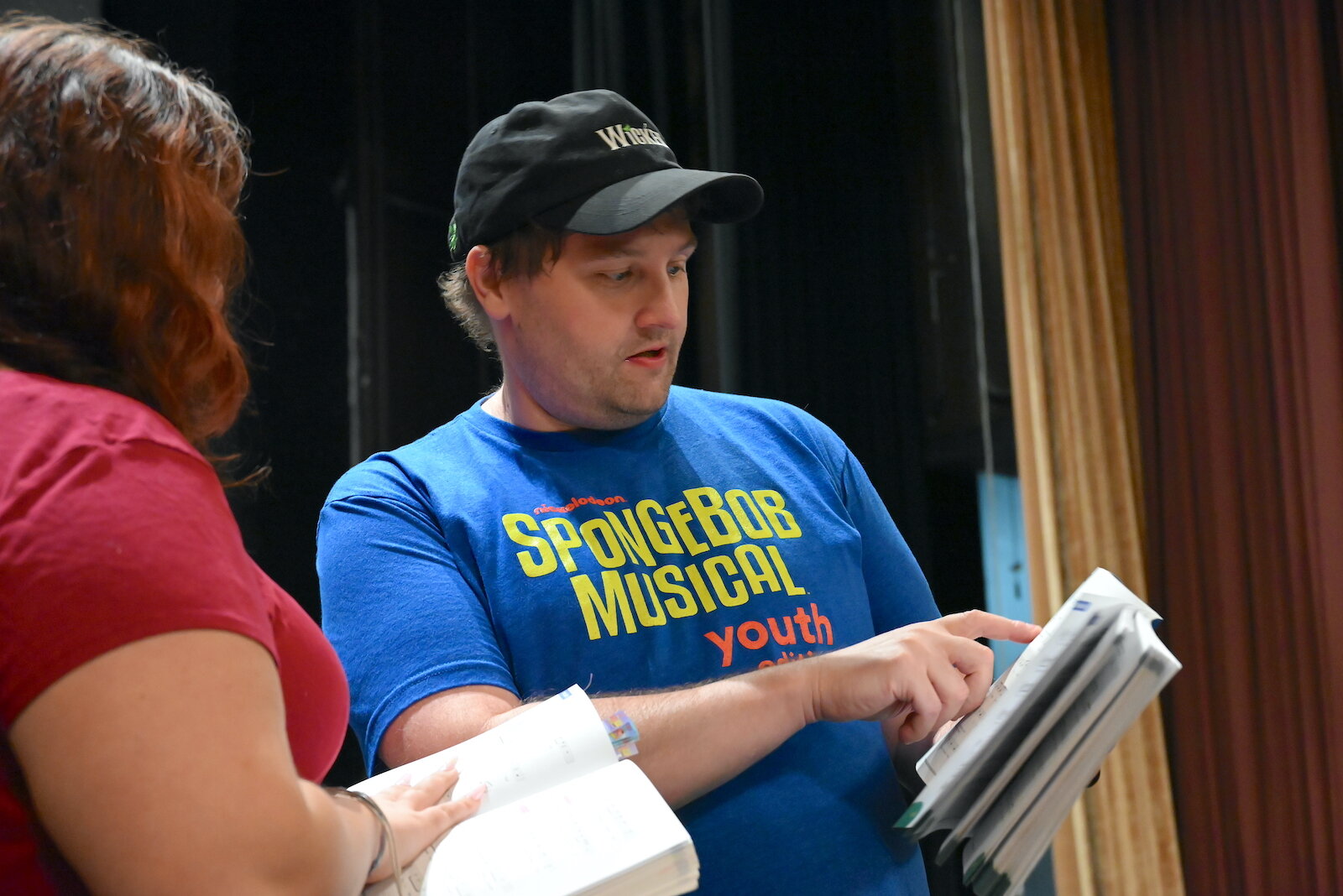 Chris Fulbright, director for the Marshall Civic Players production of “The SpongeBob Musical-Youth Edition”, works with an actor during a rehearsal.