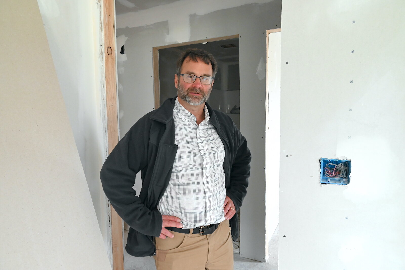 Mike King, executive director of the Battle Creek Area Habitat for Humanity, stands inside a house being built on Woodlawn Avenue.