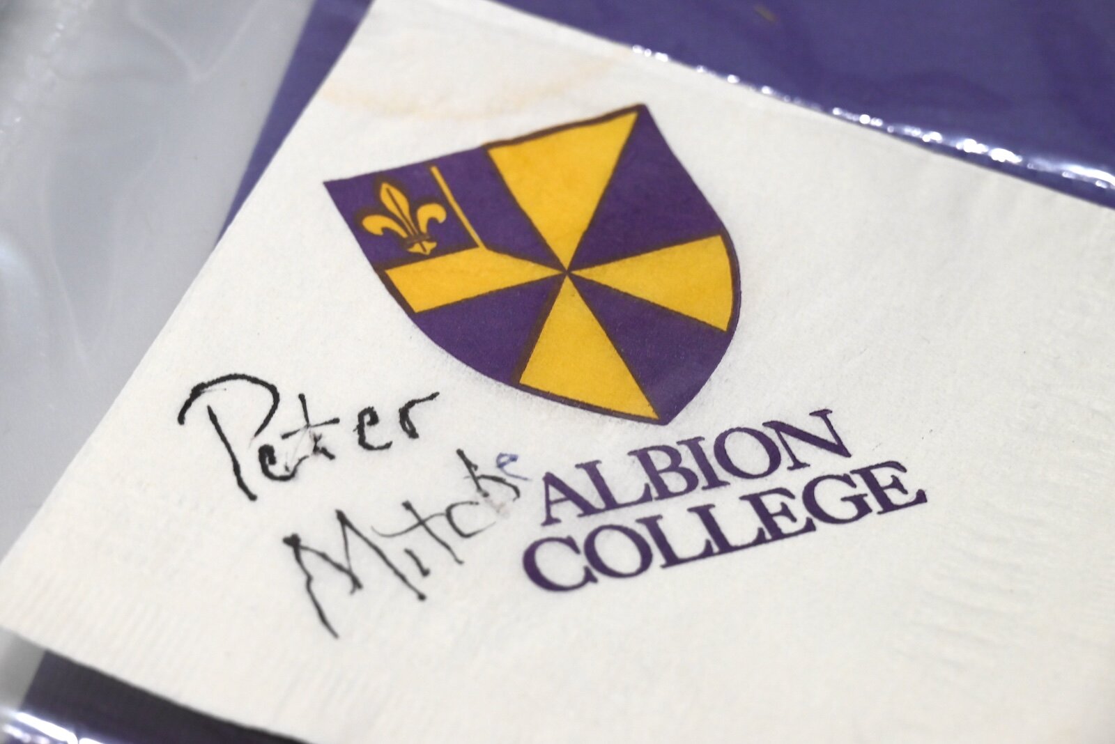  A napkin autographed by Peter Mitchell, former president of Albion College.