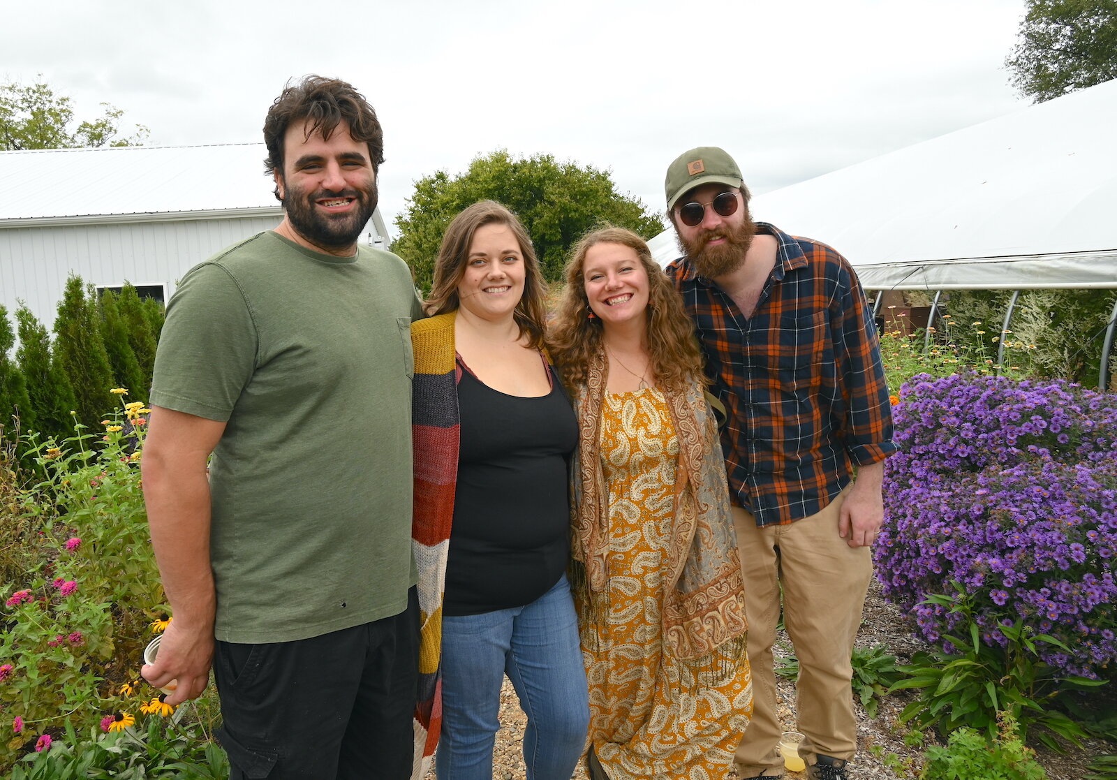 Posing for a photo during Of The Land’s harvest festival are, from left, Jake and Jessica Stull, then Jake and Kara Lohner.