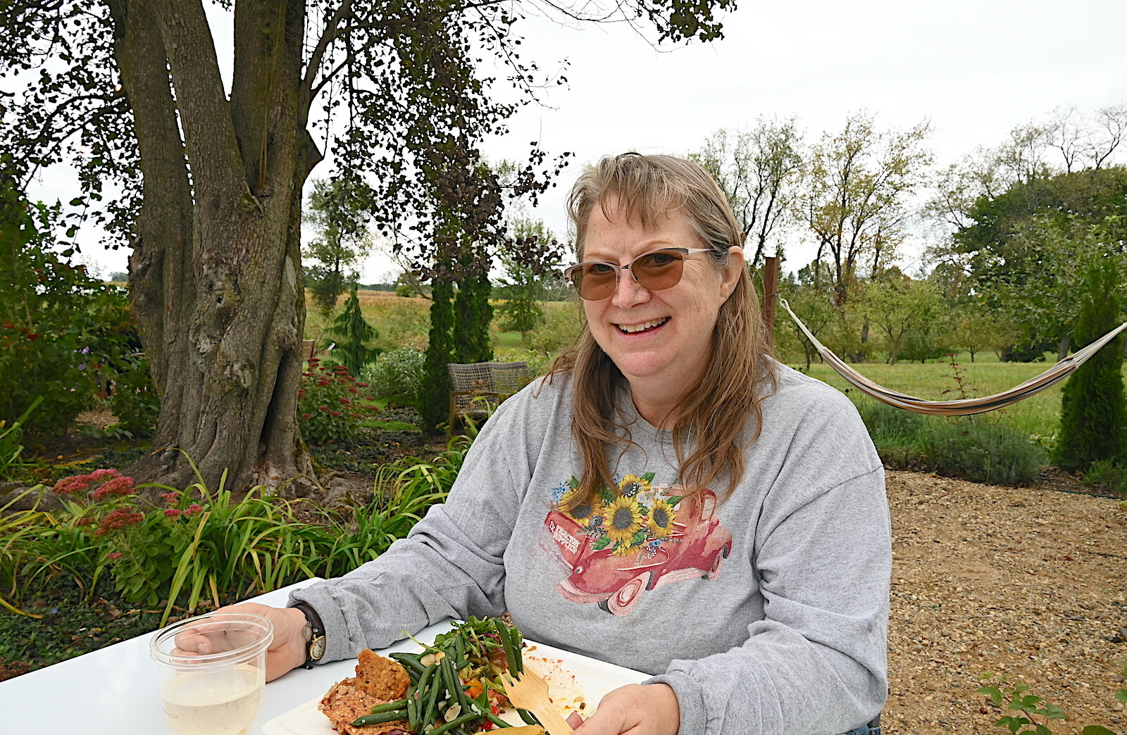  Rebekah Orr enjoys her meal during Of The Land’s harvest festival.