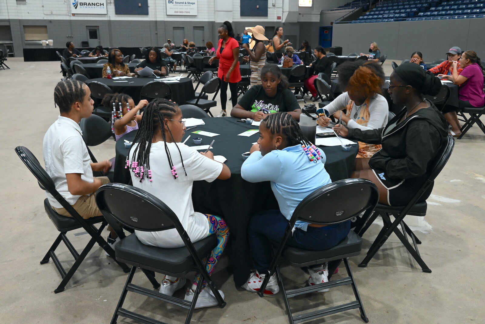 Attendees sample rice during the Village Network’s Rice and Flavor event at Kellogg Arena.