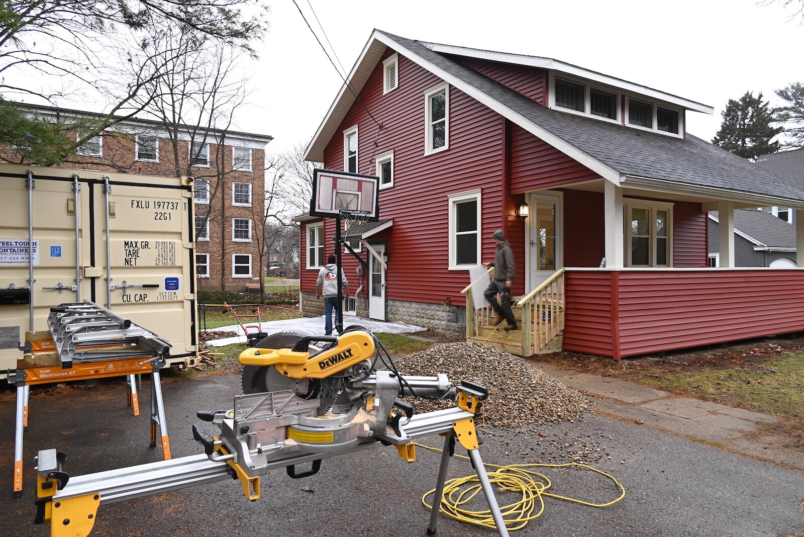 Workers with Urban Blue Development are working on a house in Albion being renovated to remove lead.