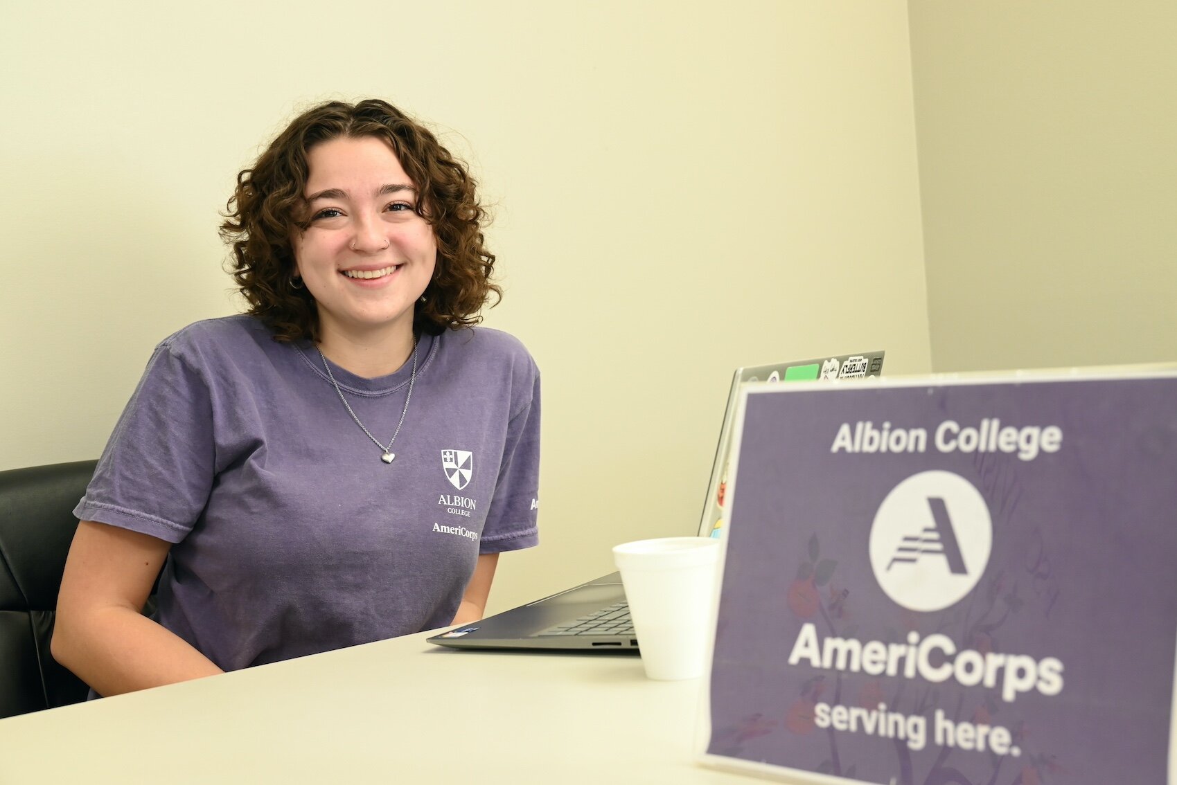 Phoebe Holm, a senior at Albion College, is an AmeriCorps volunteer providing tech advice to seniors.