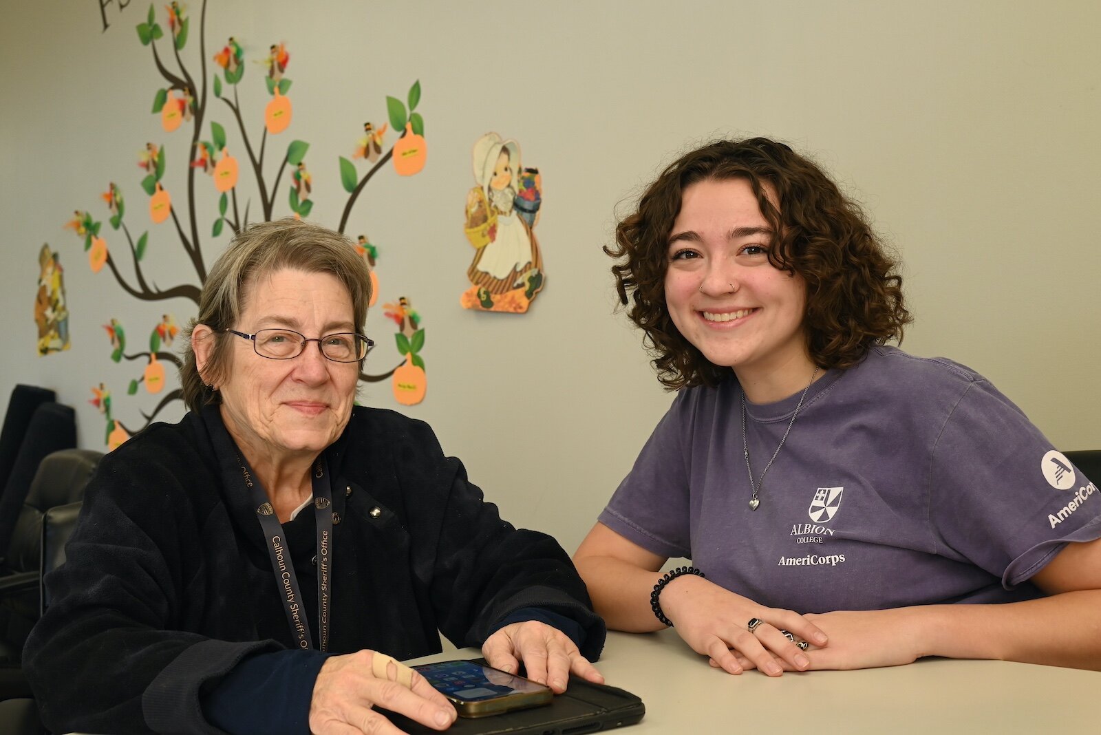 Renee Powaga and Phoebe Holm pose for a photo at the Forks Senior Center in Albion.