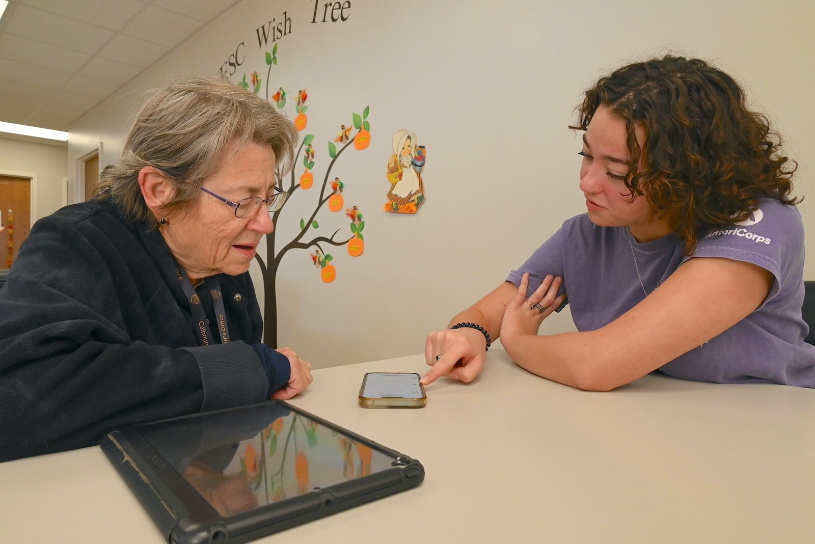 Renee Powaga and Phoebe Holm pose for a photo at the Forks Senior Center in Albion.