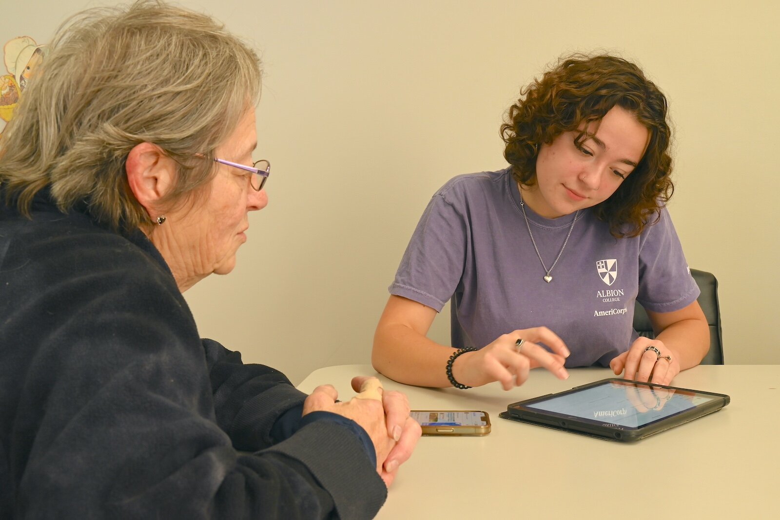 Renee Powaga and Phoebe Holm pose for a photo at the Forks Senior Center in Albion.