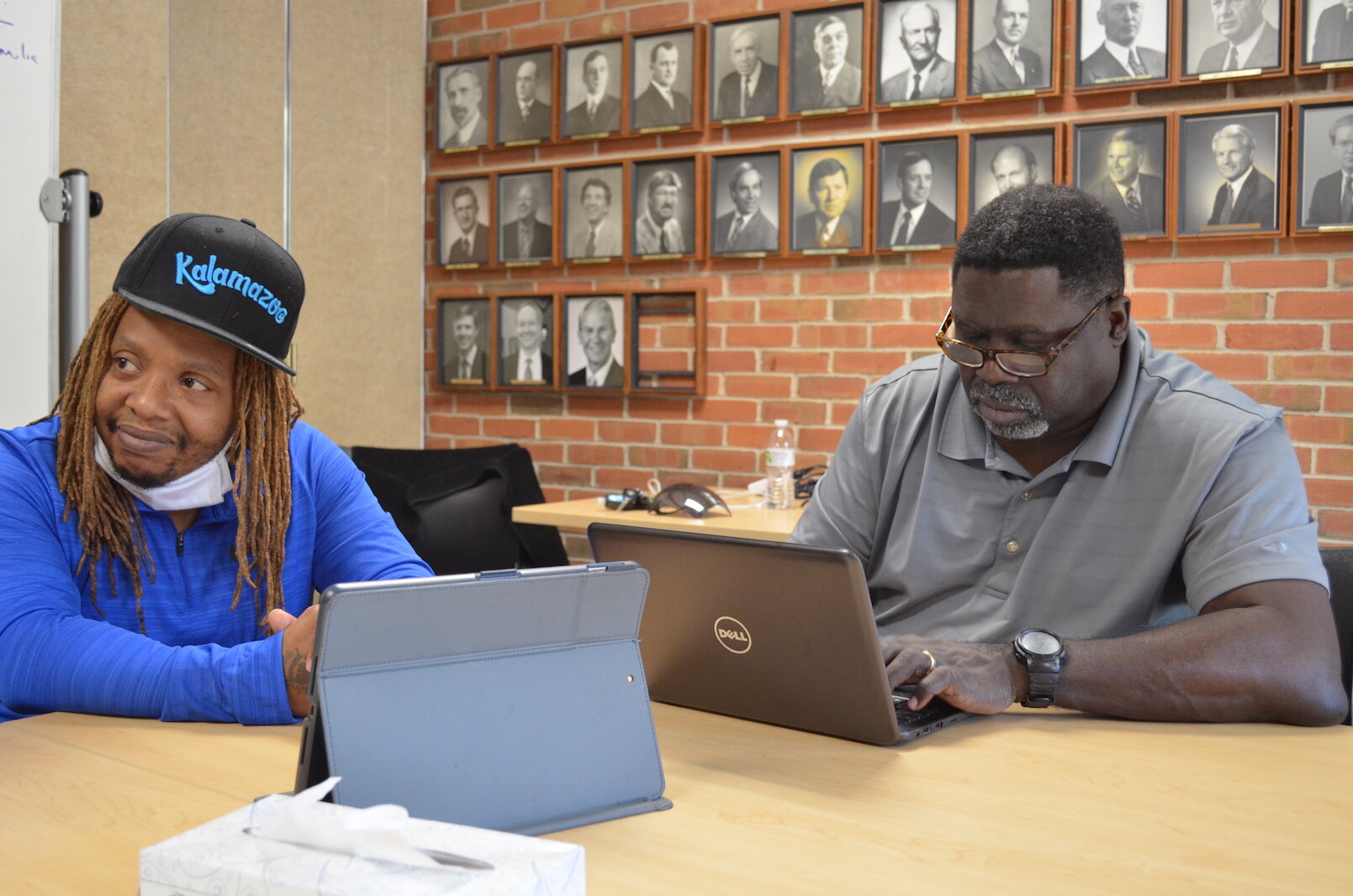 Michael Wilder, coordinator of the city of Kalamazoo’s Group Violence Intervention Program, listens to questions from Regina Kibezi for this story.