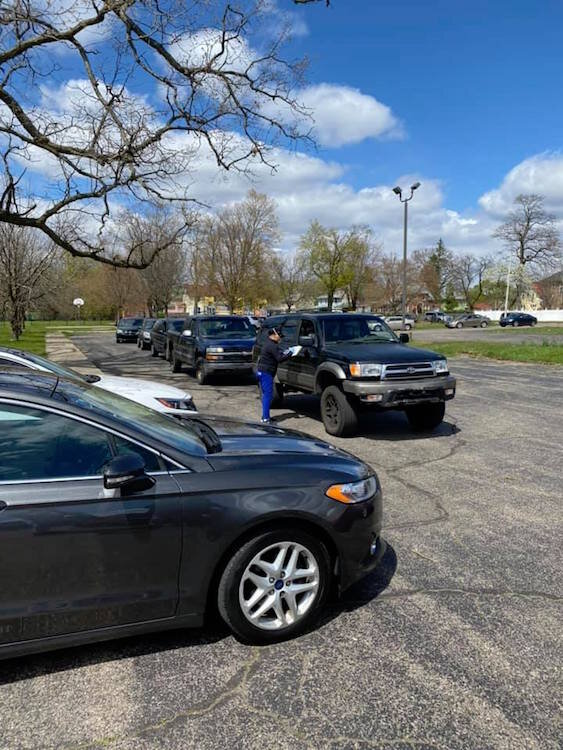 Cars begin to line up at Washington Heights United Methodist Church at 1:25 p.m for food delivery that begins Fridays at 3 p.m.