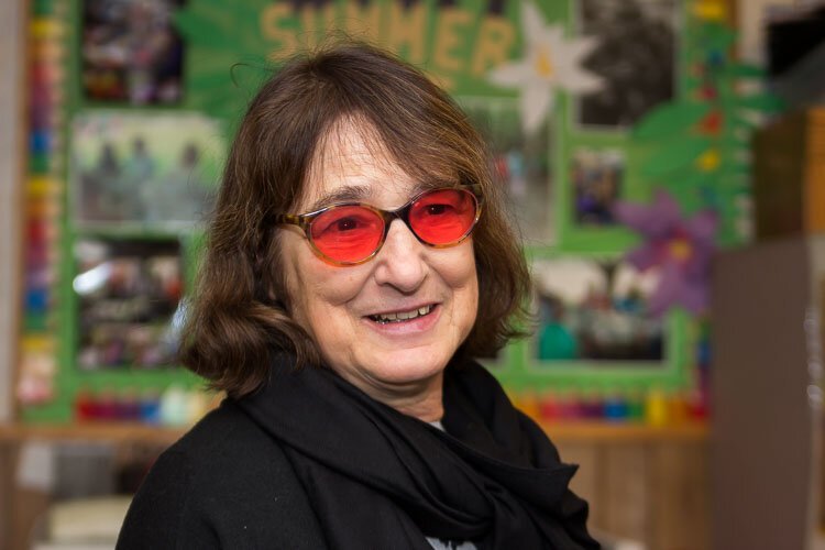 Cheryl Lord, the executive director of the Oakwood Neighborhood Association, helps area  residents at the association’s community center, at 3320 Laird Ave. It houses a community room, a computer room and a food pantry.