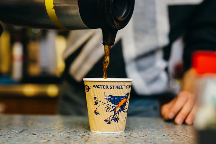 Pouring coffee at Water Street in the Borgess atrium