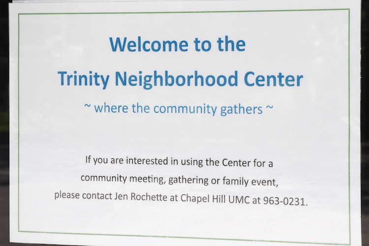 A sign on the front door of the Trinity Neighborhood Center