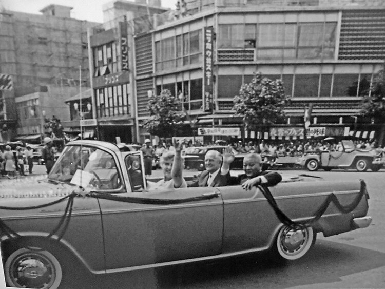 Leona Morrison waves to spectators during the parade.