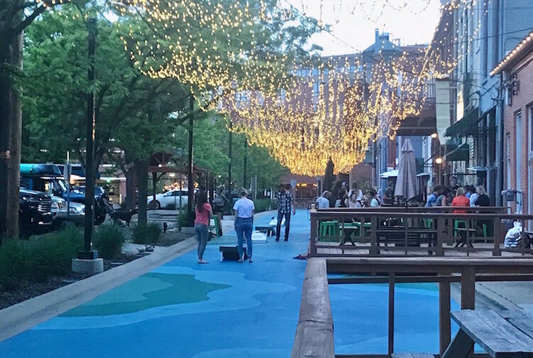 The street mural in Bates Alley in downtown Kalamazoo has been repainted and a semi-permanent pavilion has been installed. The pavilion will provide a covered performance space for live performances.