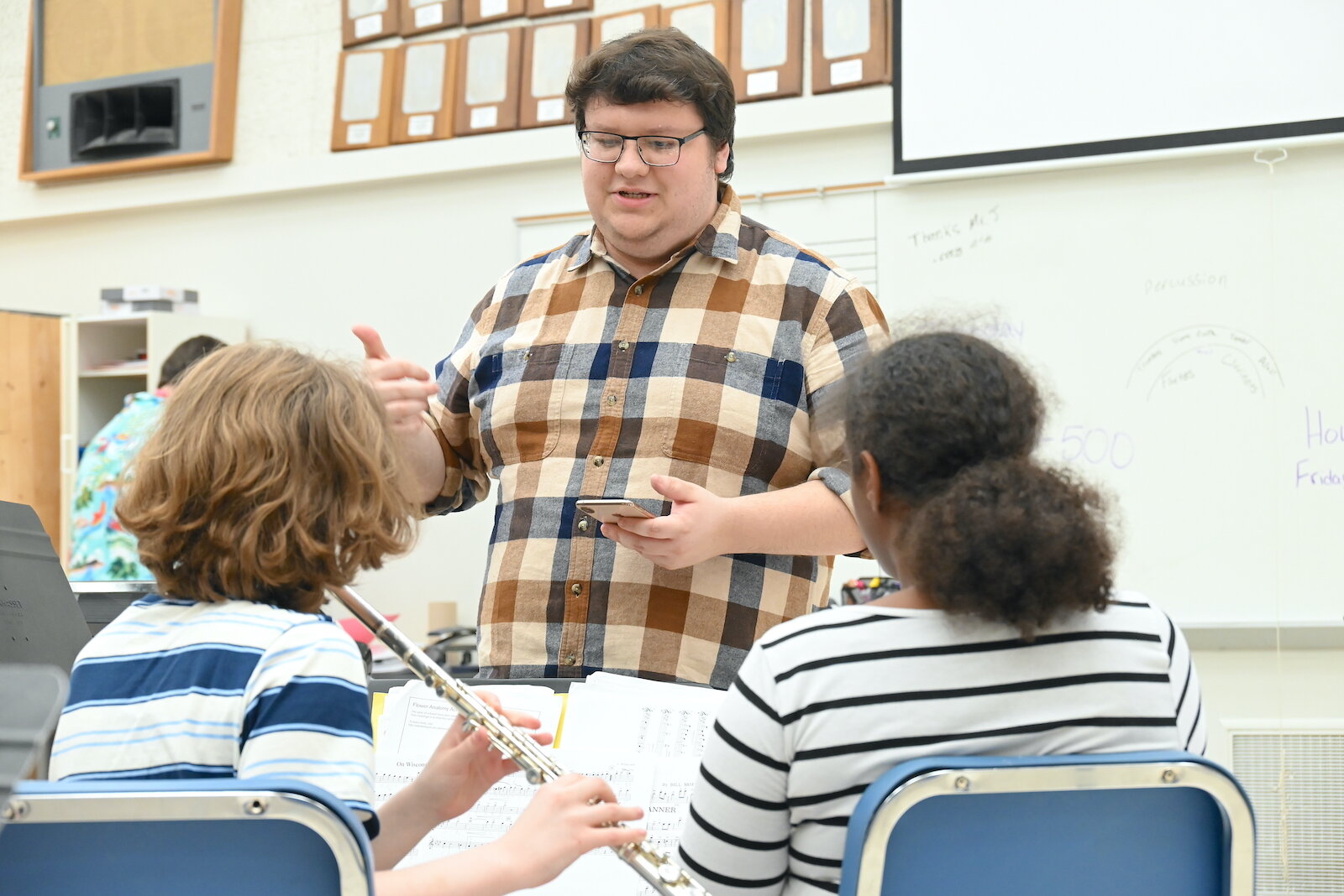 Fred Jankowski, Director of Bands at Battle Creek Central High School, works with students during a recent rehearsal.