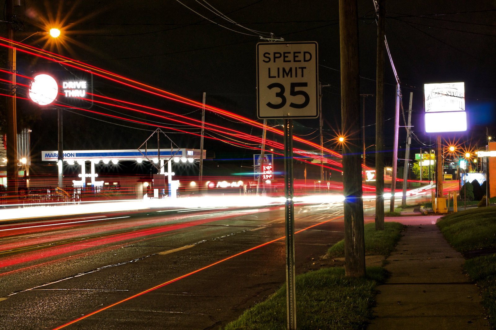 An extended exposure shot of nighttime traffic along West Main