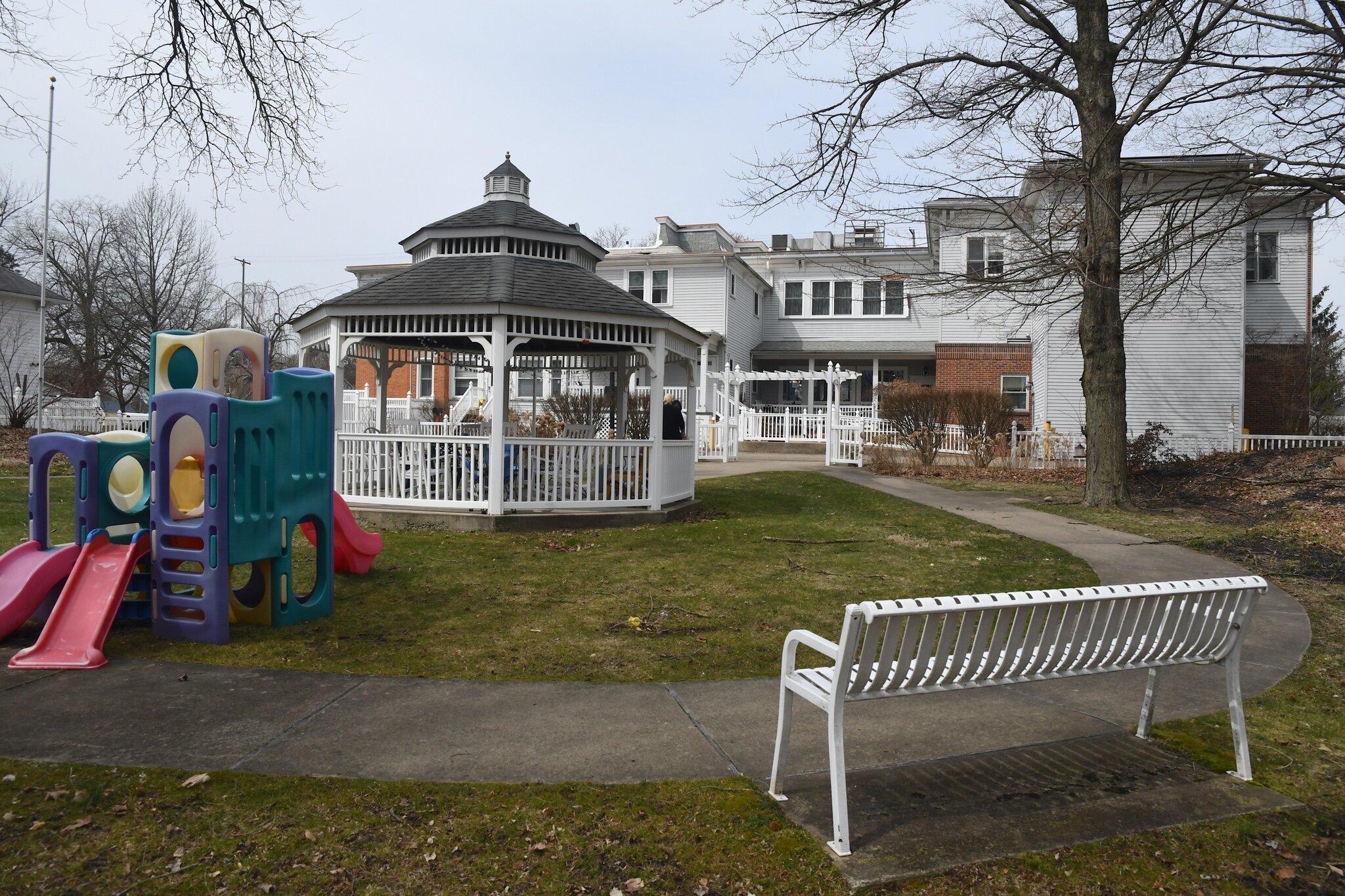 Scene of of the back of The Haven’s Women’s Life Recovery Program on Capital Avenue NE which includes a gazebo and a play area for young children.