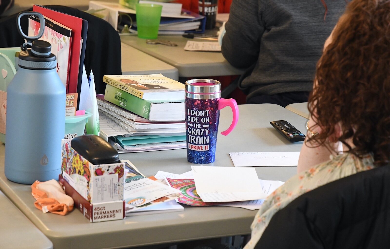 Scene of a participant in a Bible study at The Haven’s Women’s Life Recovery Program.