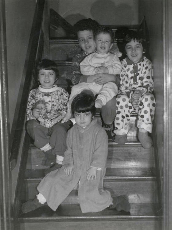 Christmas on the stairs with the five Ferraro children. 