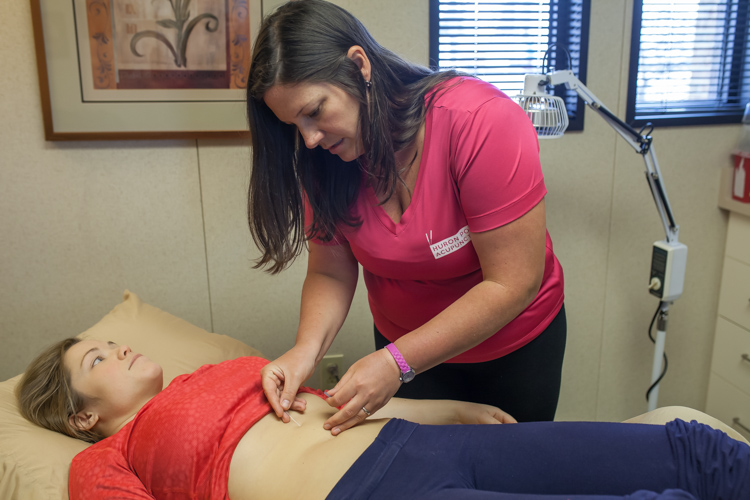 Erica Jones receives an acupuncture treatment.