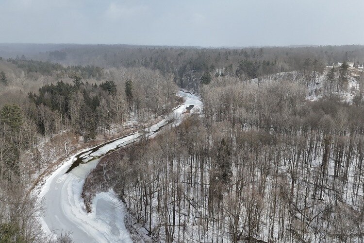 The Black River in Grant Township meanders through a frozen landscape.