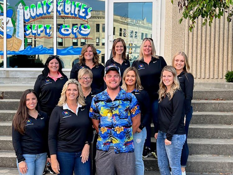 St. Clair County Child Abuse and Neglect Council poses for a photo with Mark Markham (bottom middle) of Q Country 107 during the organization's annual Community Roof Sit for Kids fundraising event.