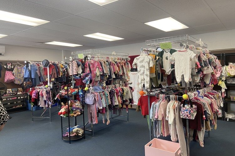 Baby clothes inside Harbor Impact Ministries.