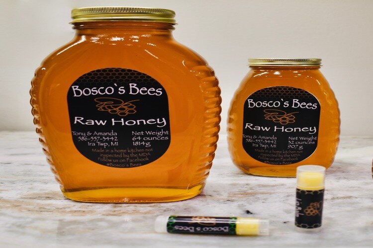 Bosco's Bees jar of honey and lip balm.