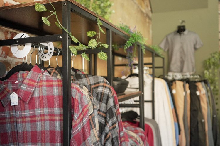 Mens clothing section inside Devine Designs Downtown.