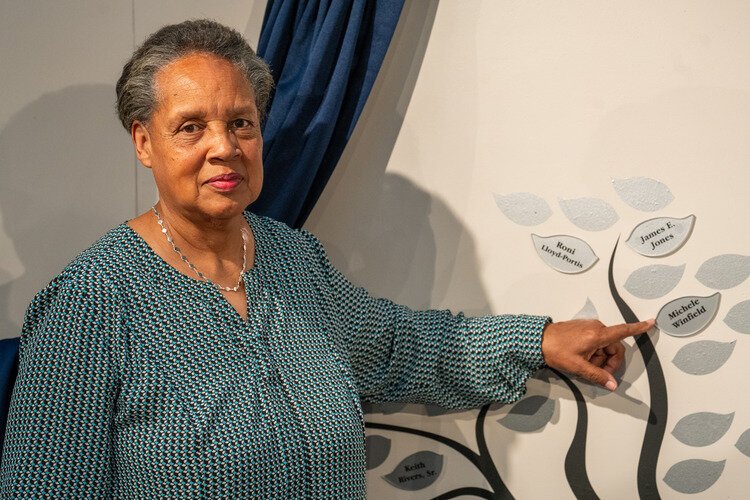 Michele Winfield points out her name on the Stanley Legacy Wall.