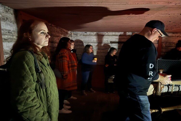 Mike Delavan in Kammer Cabin with participants. 