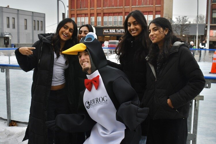 A Penguin Race contestant surrounded by fans.