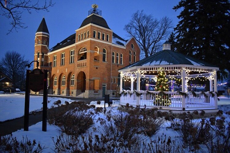 The 1884 Romanesque Marine City Hall is illuminated by twinkling lights