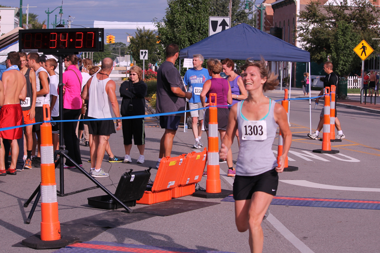 The woman smiling is Jennifer Knightstep, keeping pace in the 2012 Maritime Days 5K Marathon.