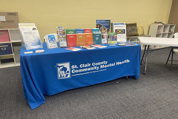 St. Clair County Community Mental Health table at Harbor Impact Ministries.