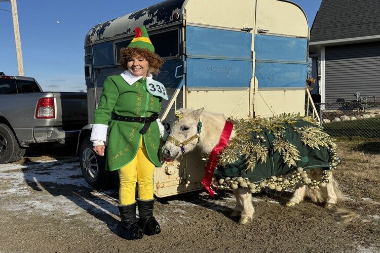 Suzanne Demink and Sally Mae, a white rescue pony.