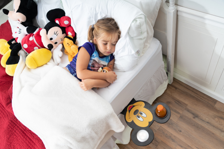 The Disney Smart Shelf tucks into mattresses to keep items like books and water handy.