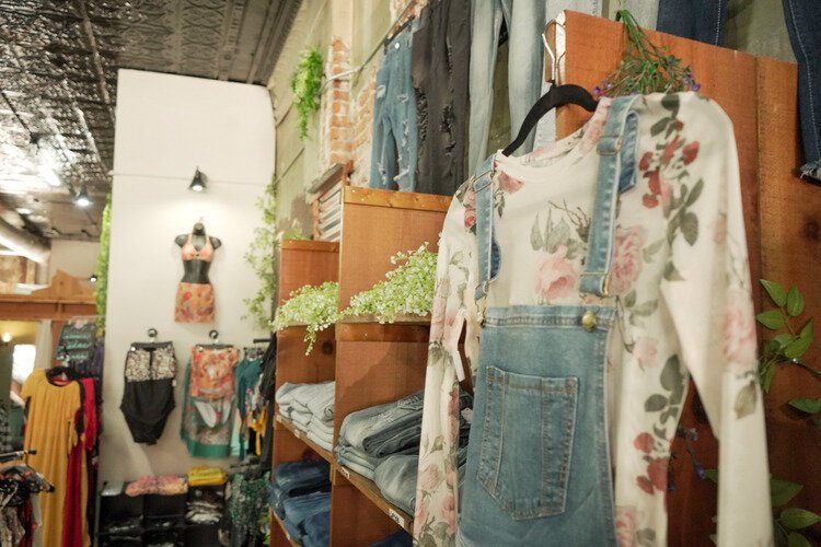 Women's clothing section inside Devine Designs Downtown