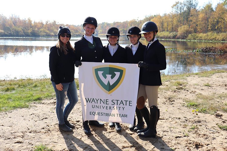 Wayne State University's equestrian team poses for a photo.