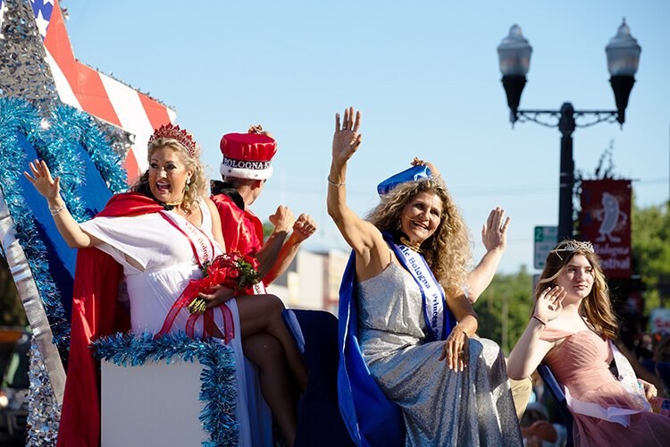 Members of the royal court and the 2023 Yale Bologna Festival's King and Queen of Bologna wave to crowds during the parade.