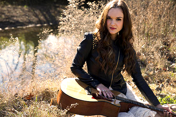 Hannah Bethel and her trusty guitar. 