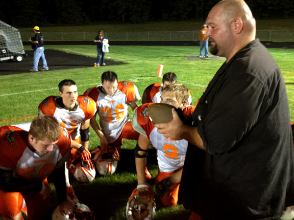 Head coach Jeremy Herman talks to the Wolverines. 