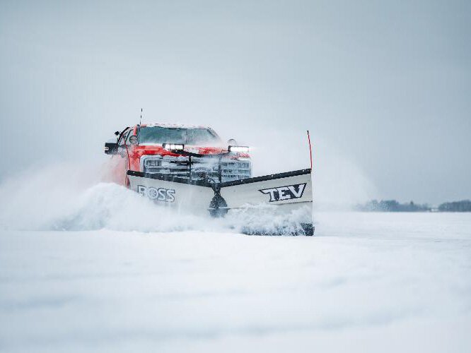 BOSS Snowplow’s first Trip-Edge V-Plow, designed to prevent damage to both the plow and vehicle when striking low profile obstacles.