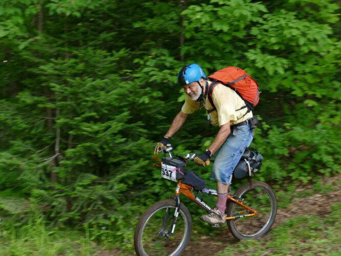 Kiko Silvelet rides his BMX bike 'Glamour Girl' during Miners Revenge – a mountain bike race in the Upper Peninsula. 